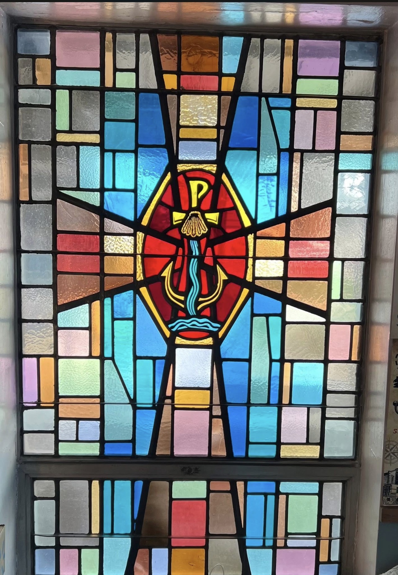 Historic stained-glass window preserved at the Rose Garden Center for the Arts