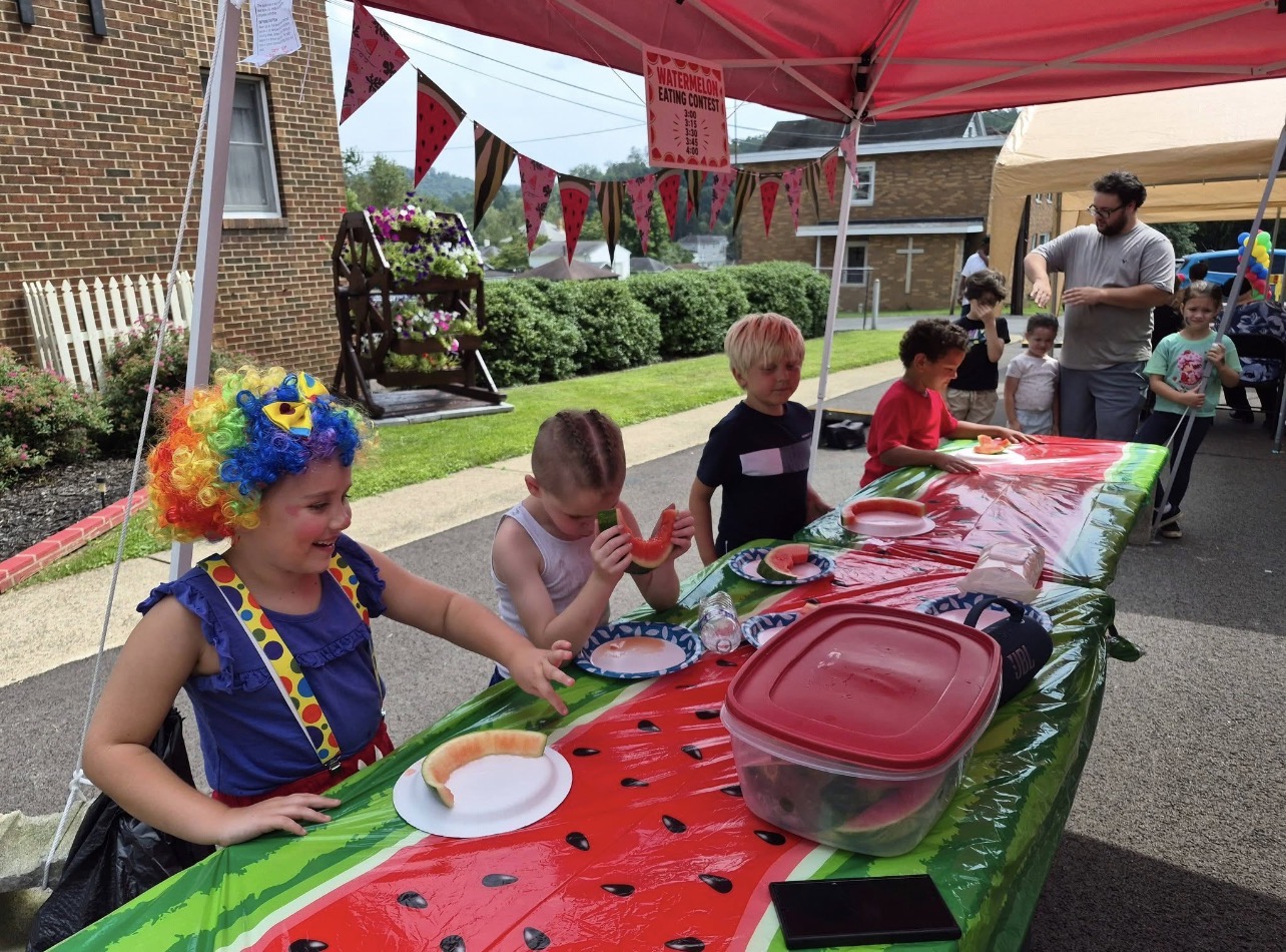 Children taking part in the watermelon-eating contest at the Rose Garden Community Barbecue in June 2026