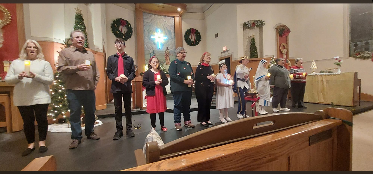 Festival of Lessons and Carols — 2025 ensemble performing by candlelight