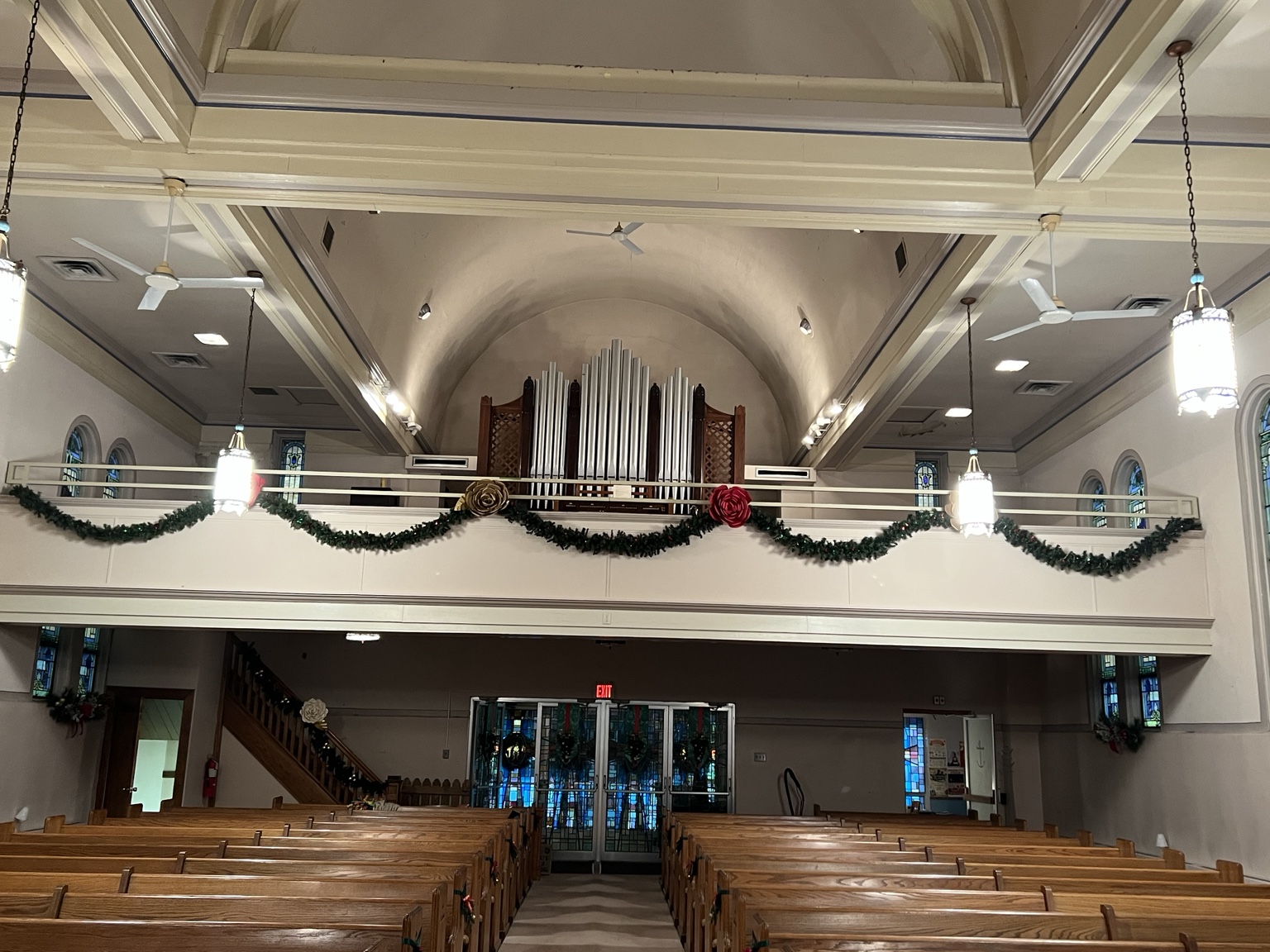 Historic pipe organ and balcony in Catherine Kelly Auditorium decorated for Christmas